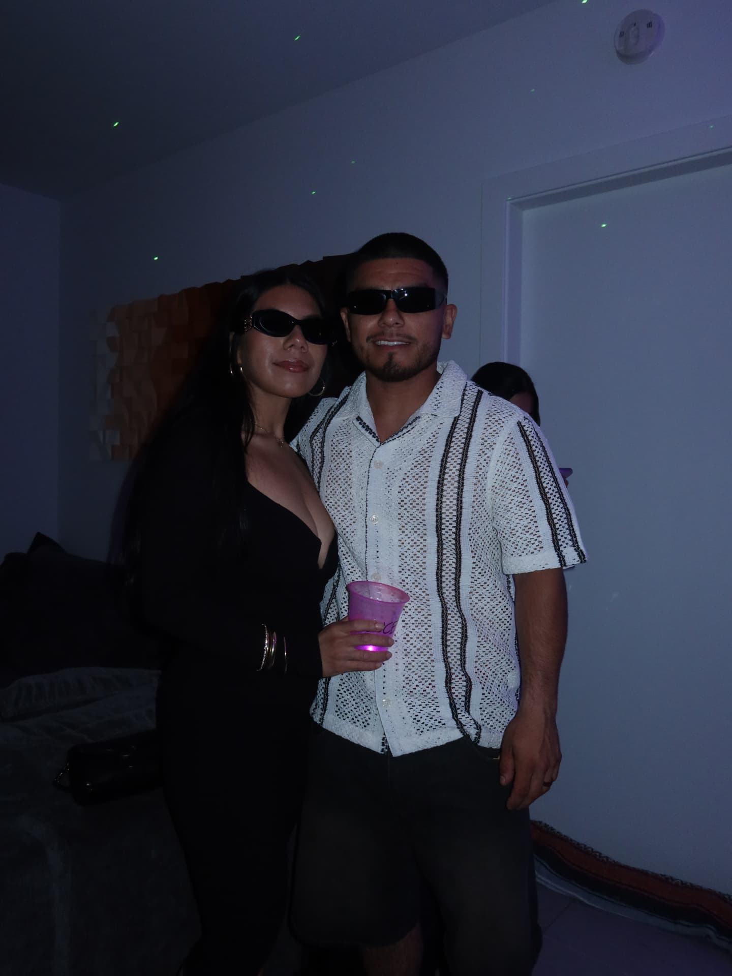 T's Birthday — couple in shades with drinks